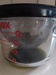 Chickweed in a pyrex measuring cup