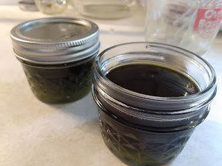 Jars of black liquid