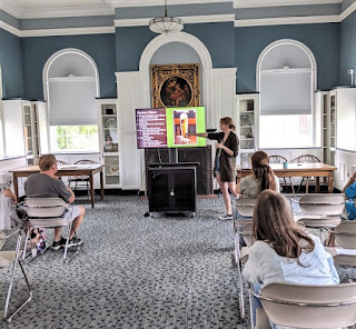 Lady giving a powerpoint presentation of pilsners