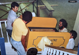 People lifting a large box