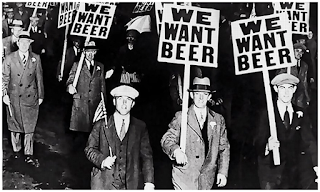 Protesters with "We want beer" picket signs