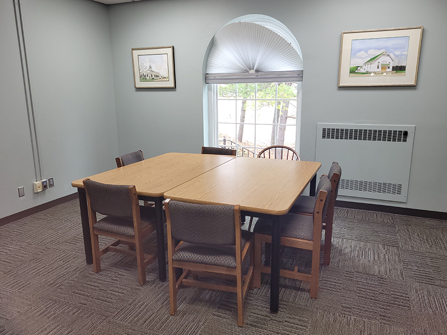 2nd Floor South Meeting Room interior with two tables pushed together and chairs on outside