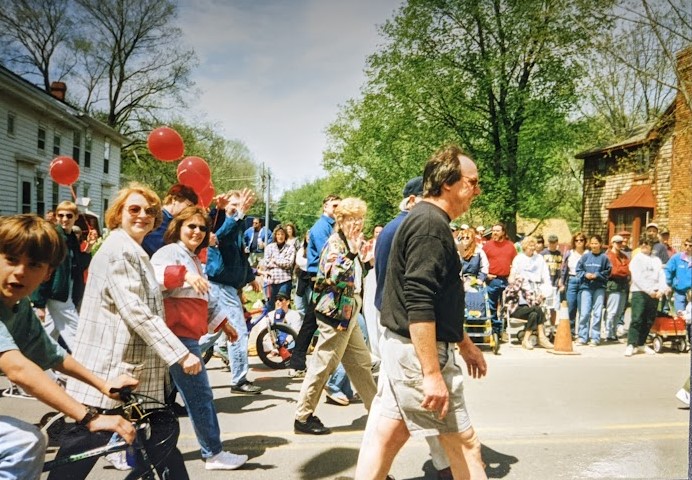 Library staff and board members walking in the Memorial Day parade of 1997.