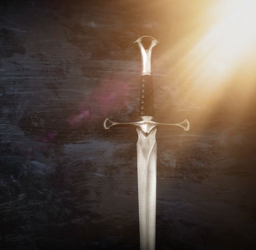 Sword against a wall, with sunlight in the corner. 