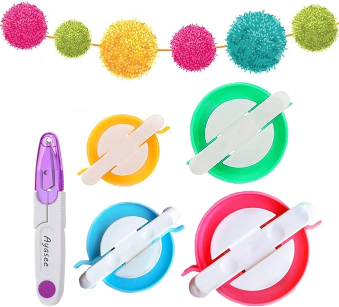 Image shows 4 sizes of pom pom maker, scissors, and a row of pom poms