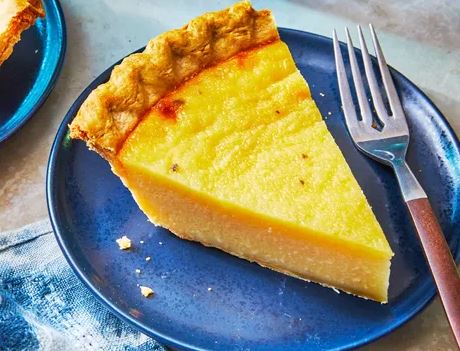 A potato pie slice on a blue plate. 