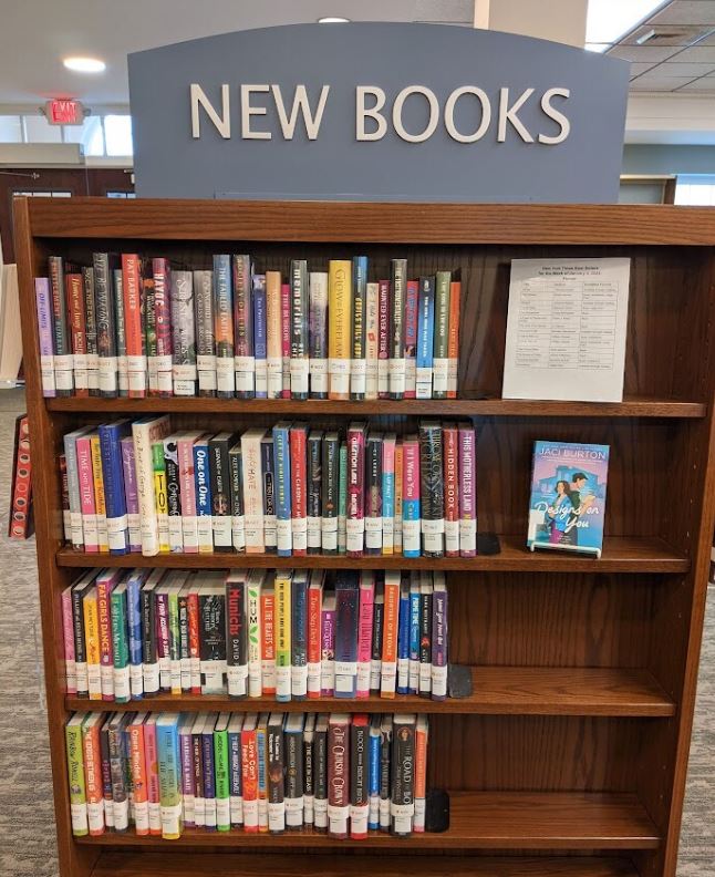 Shelf of New Books in the Library. 