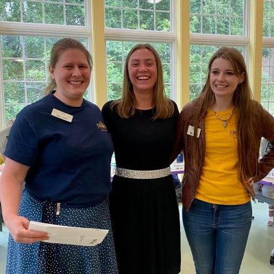 Librarian Lucy, Breanna, and Librarian Kelsey in the Youth Program Room of the Library.