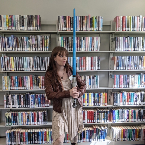 Librarian Kelsey with a lightsaber! 