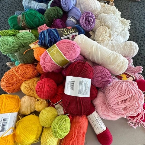 A large pile of multi-colored yarn in the third floor Community Room. 